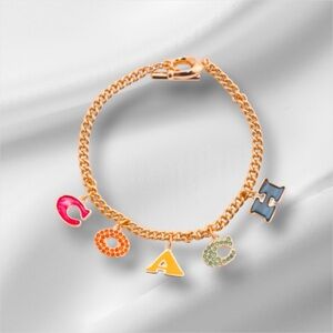 Coach Gold Bracelet with Colorful Enamel Charms